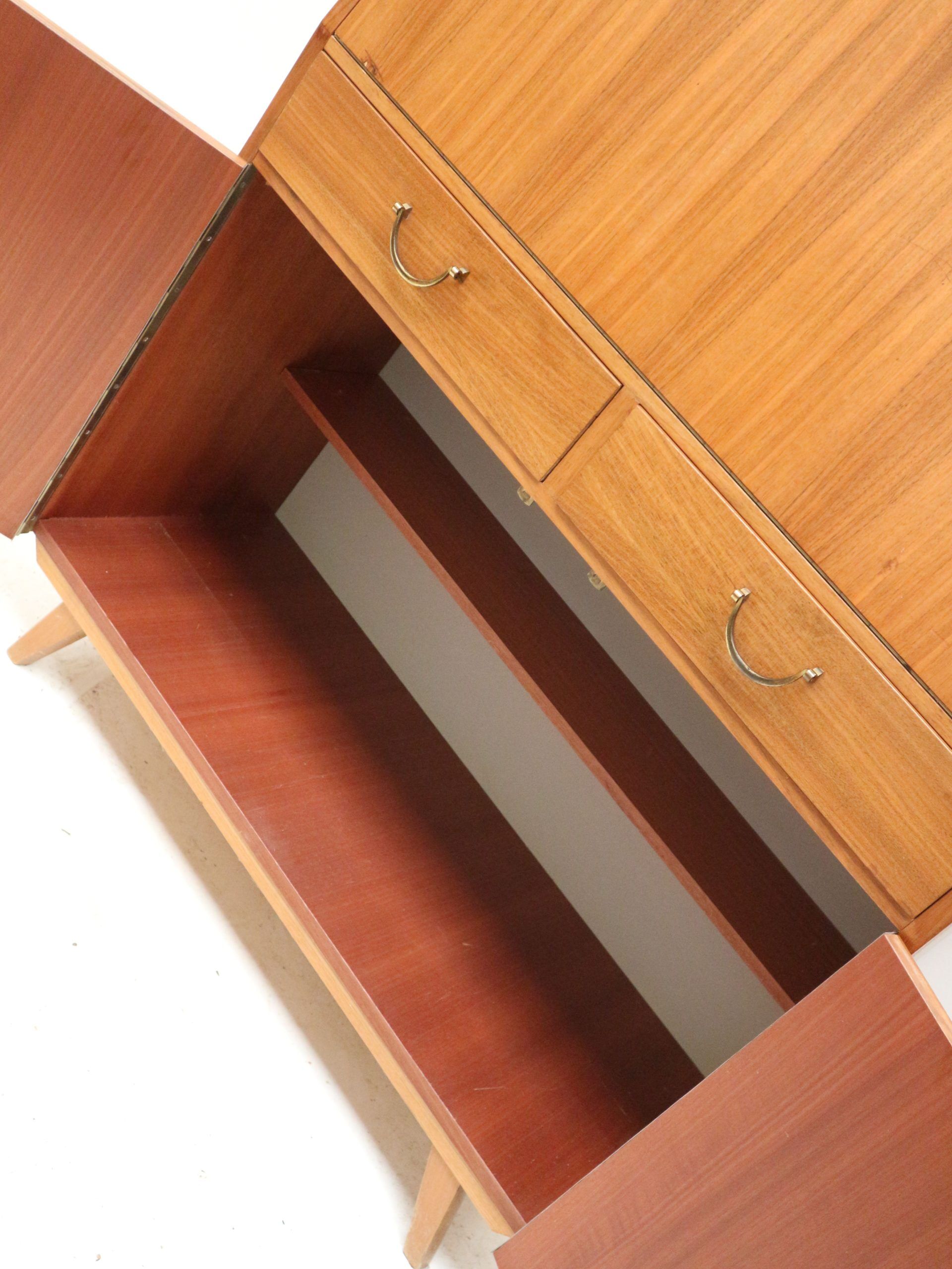 Vintage secretary with drawers, drop-down and doors from the 1960s.