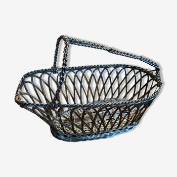 Old basket carrying silver metal serving bottle