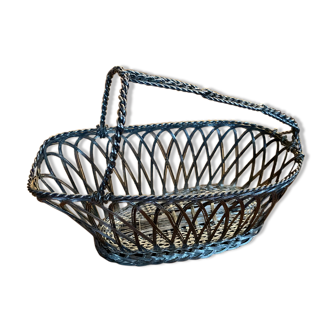 Old basket carrying silver metal serving bottle