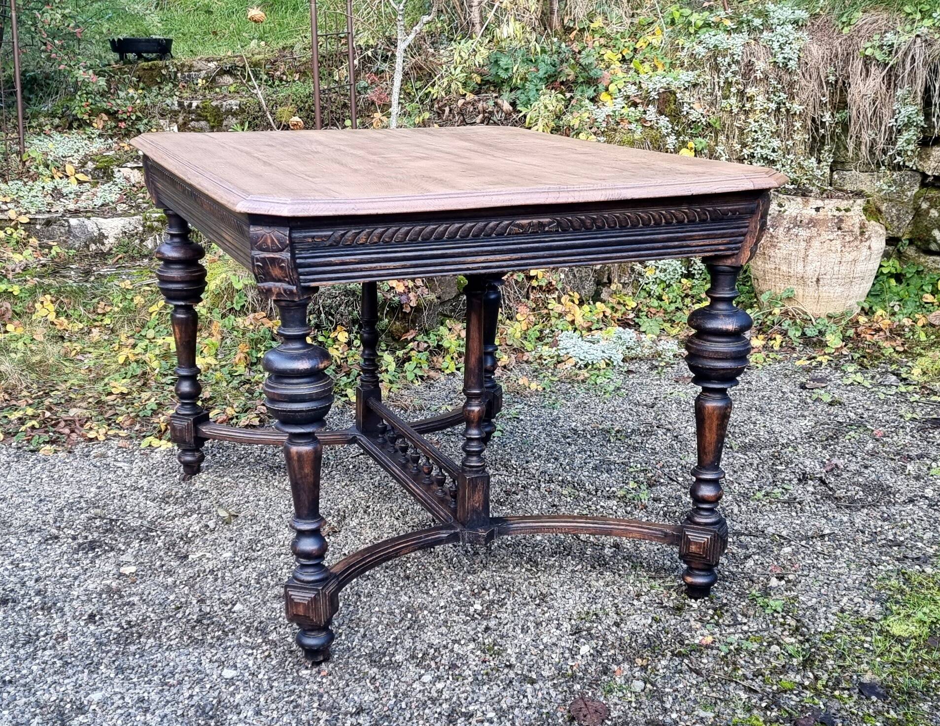 Table from the late 19th century, neo-Renaissance style, in black and oak.