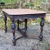 Table from the late 19th century, neo-Renaissance style, in black and oak.