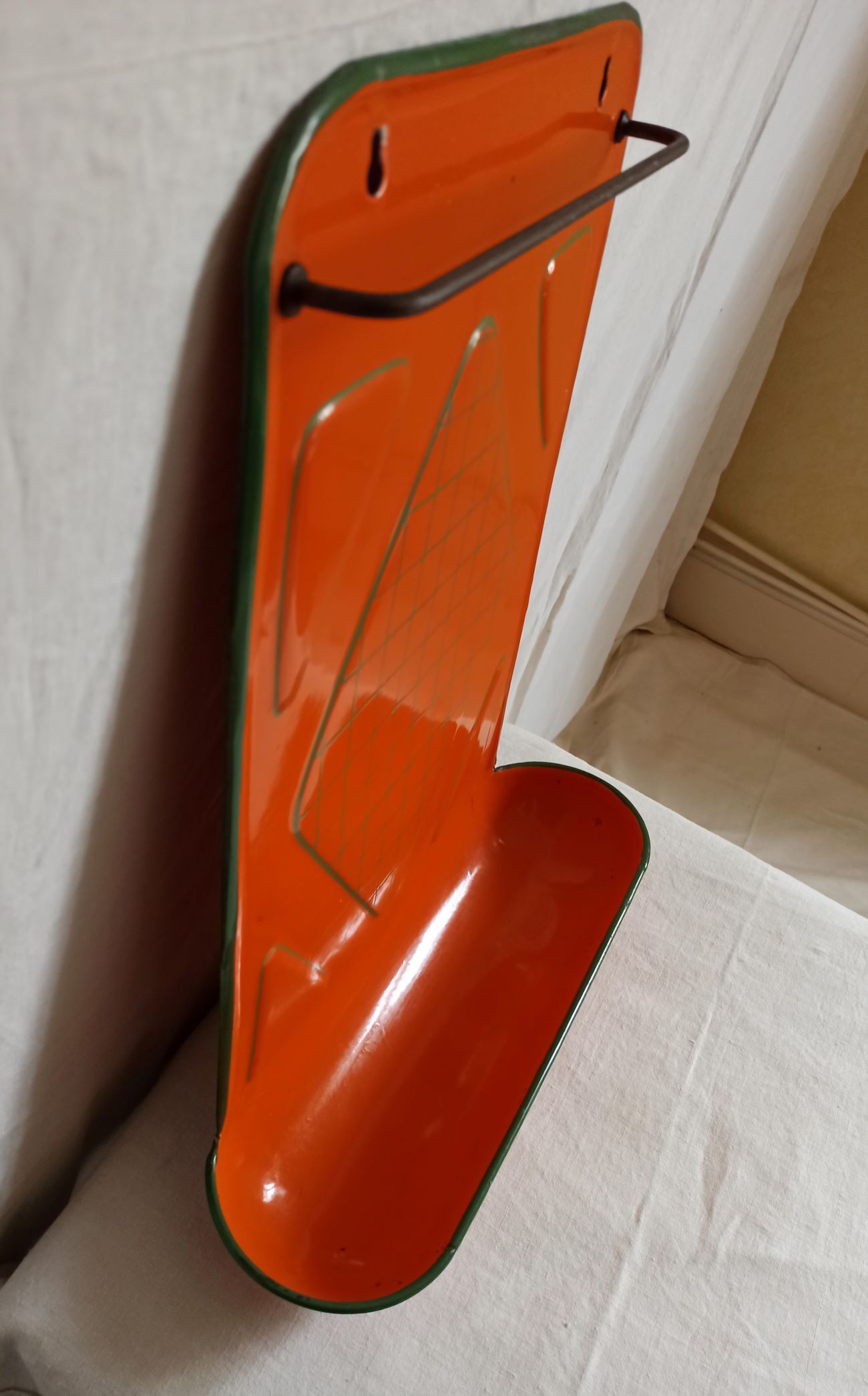 Orange enamelled kitchen utensil door
