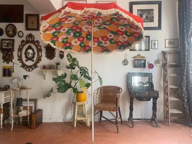 Large floral tilting beach umbrella with cotton fringes, 1960