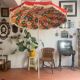 Large floral tilting beach umbrella with cotton fringes, 1960