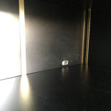 Shelves of black and gold windows