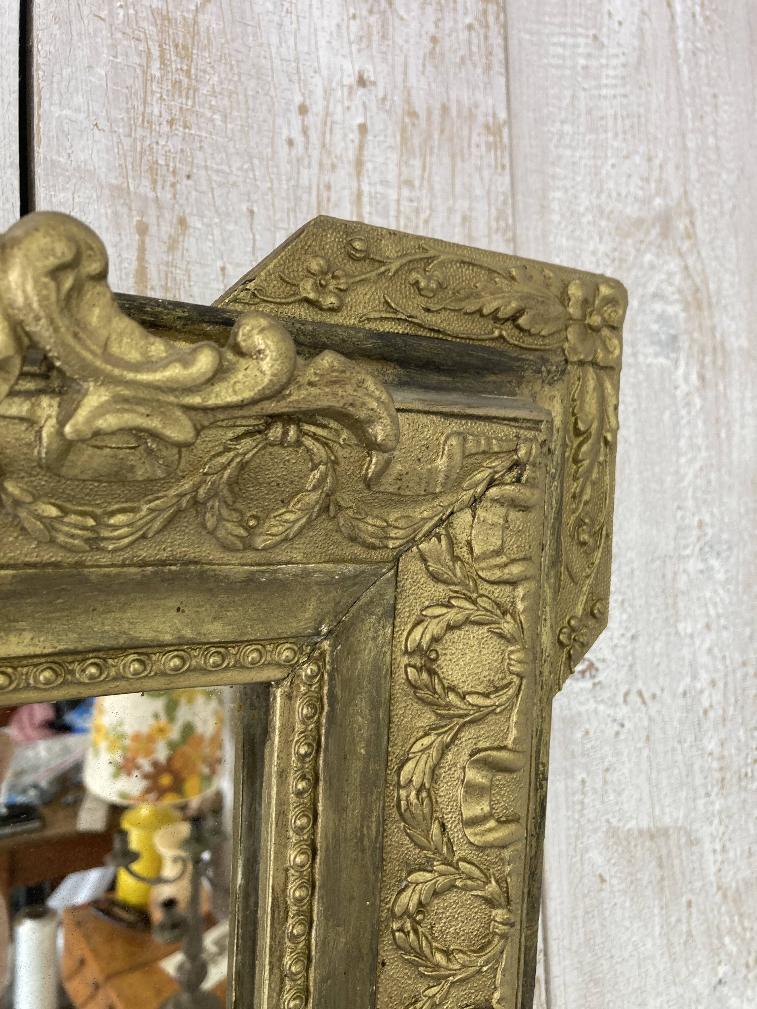 Antique mirror with a pediment