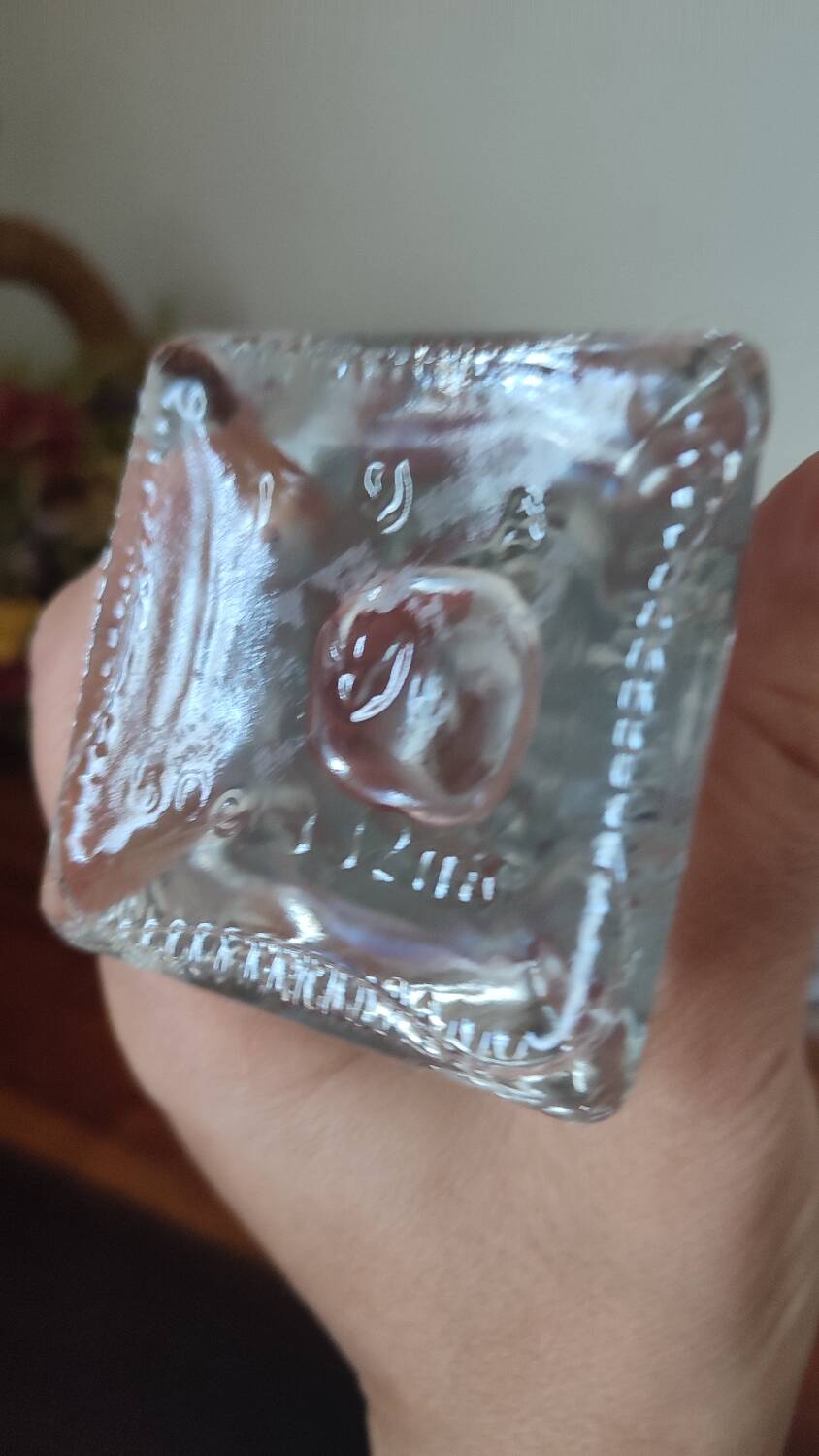 Pressed glass carafe in the shape of a bunch of grapes.