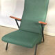 Lounge or easy chair with armrests