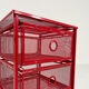 Chest of drawers on red metal wheels, 1980