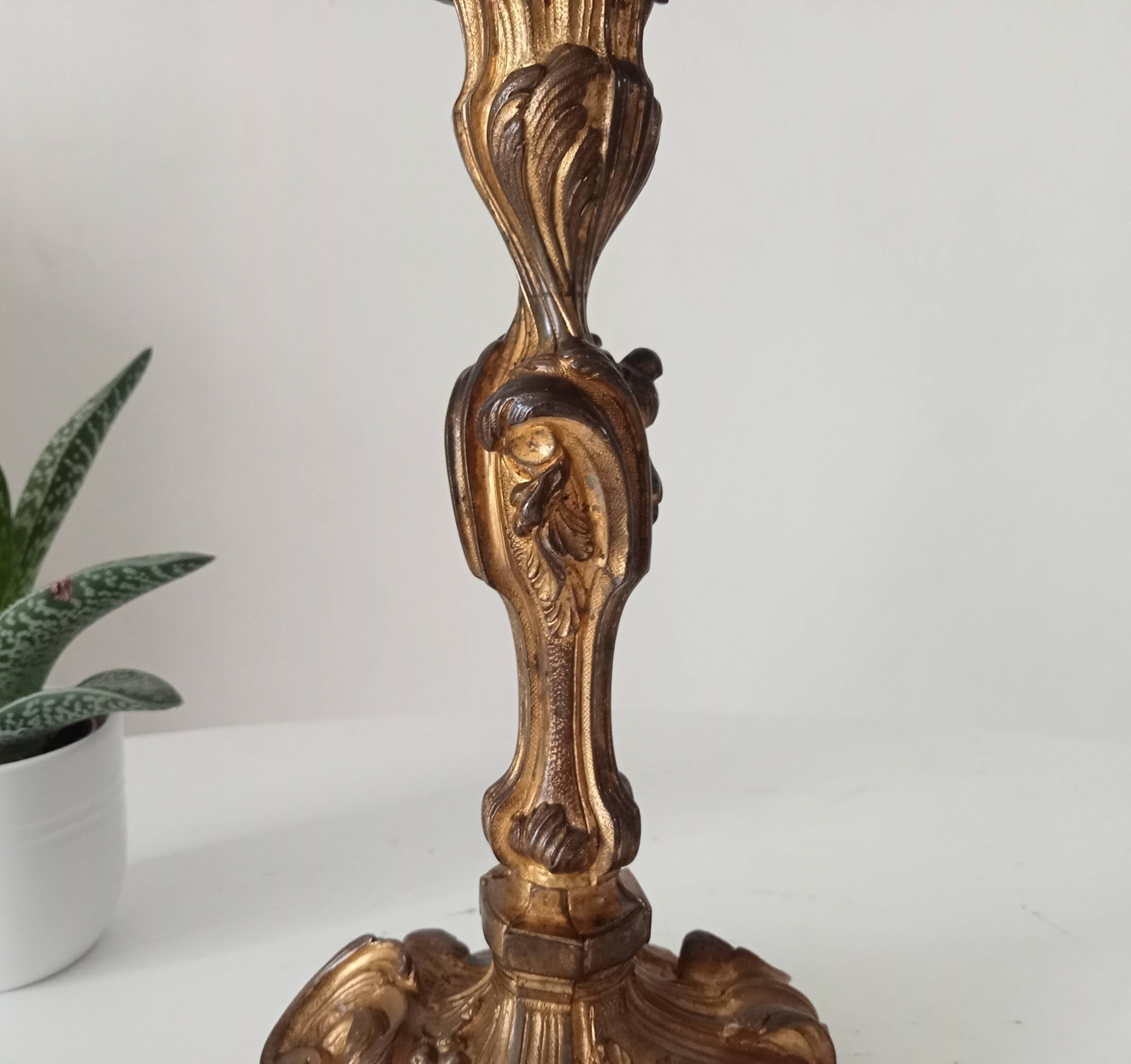Antique 19th-century solid gilded bronze candlestick in the Louis XV style.