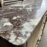 Raw wood chest of drawers with marble top