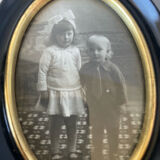 Pair of black wooden oval frames 1880’s  each 13 cm x 10 cm glass measurements 8.5 cm x 5.5 cm