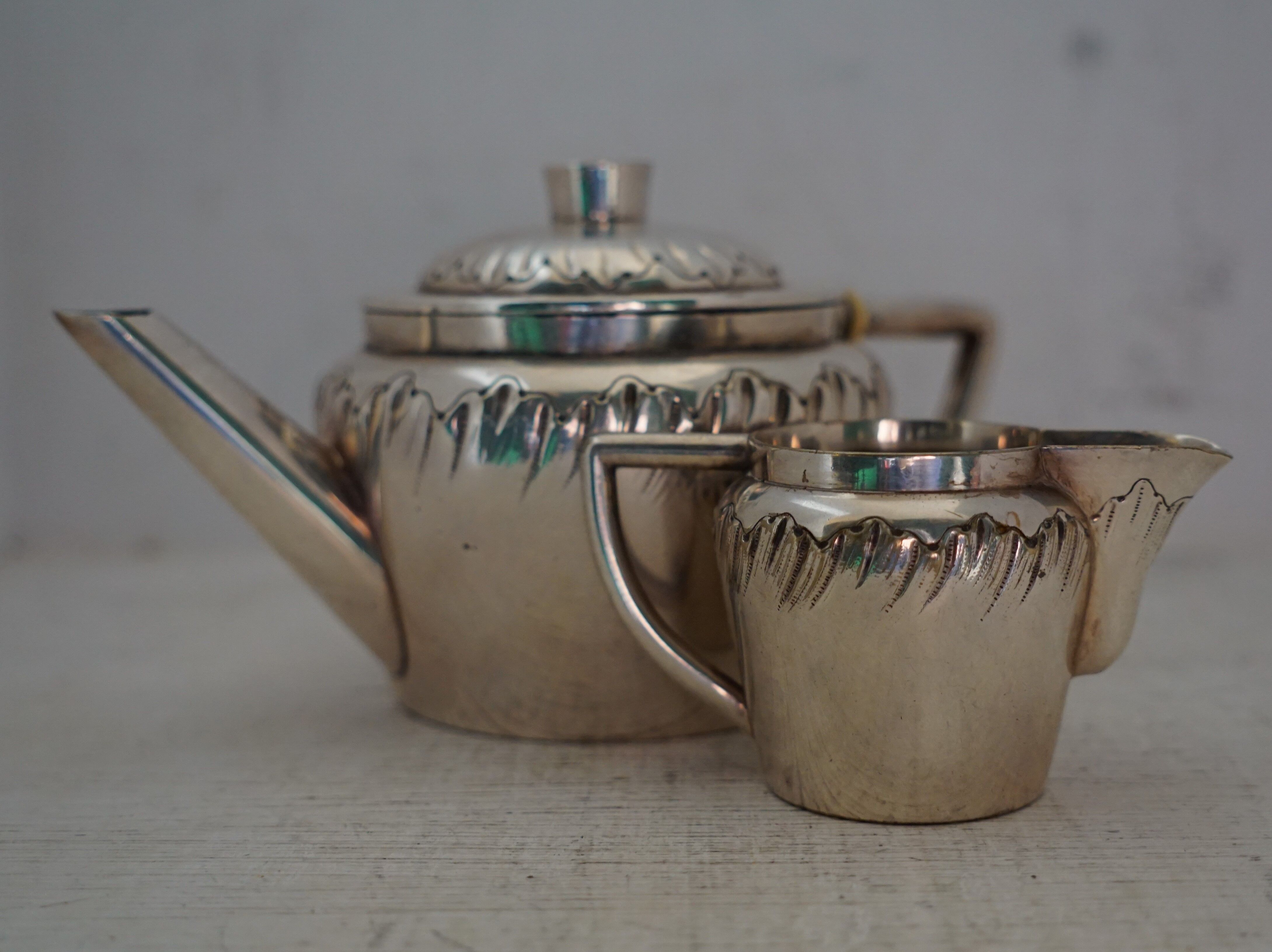 Teapot and milk jug English silverware