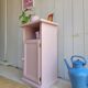 Antique bedside table revamped in pink.