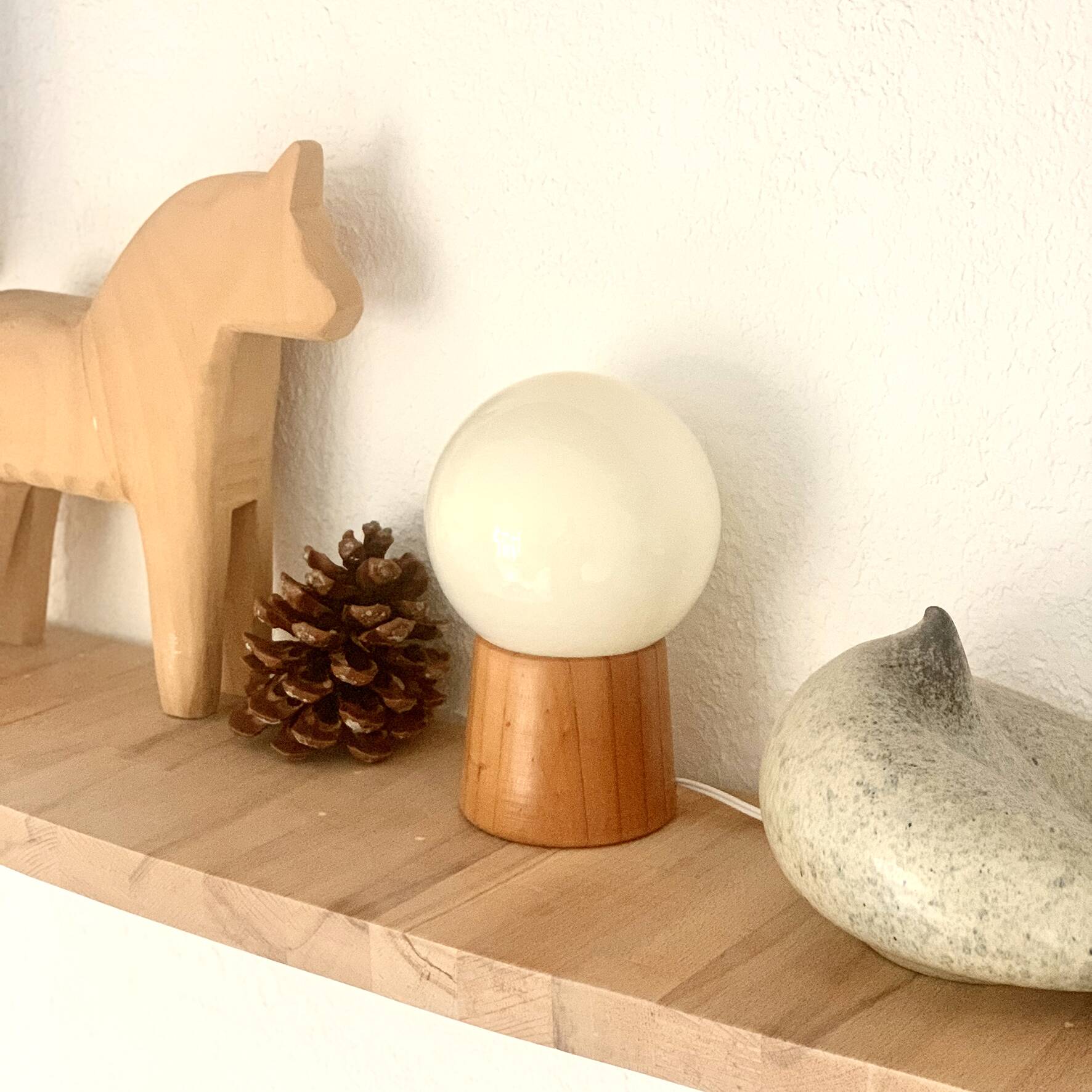 Pair of lamps with wooden base and glass globe, 1970s