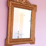 Napoleon III mirror with rich gilded ornamentation