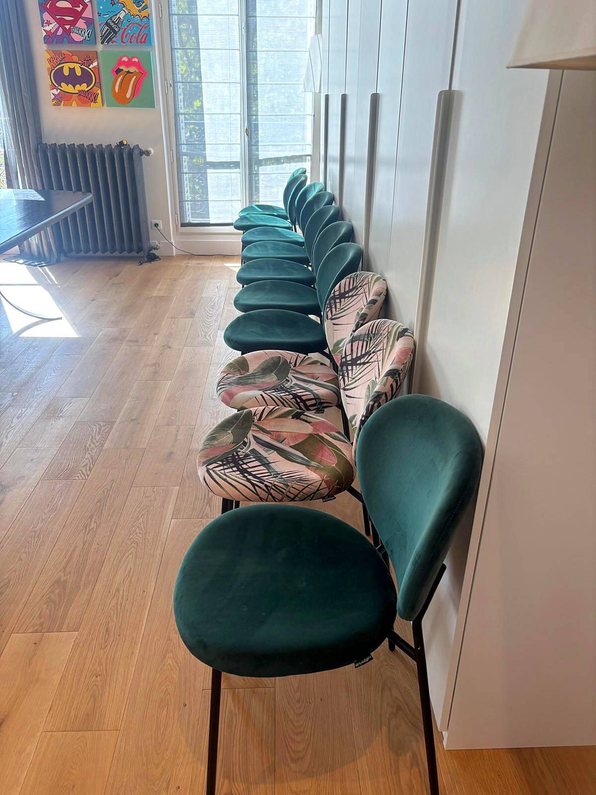 Set of 10 Calligaris Ines chairs in green velvet and tropical fabric.