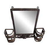 Art Deco wall-mounted brush holder mirror in wrought iron.