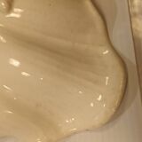 Old earthenware dish on foot