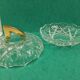 Round crystal box and a golden metal handle