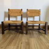Pair of low wooden and straw armchairs