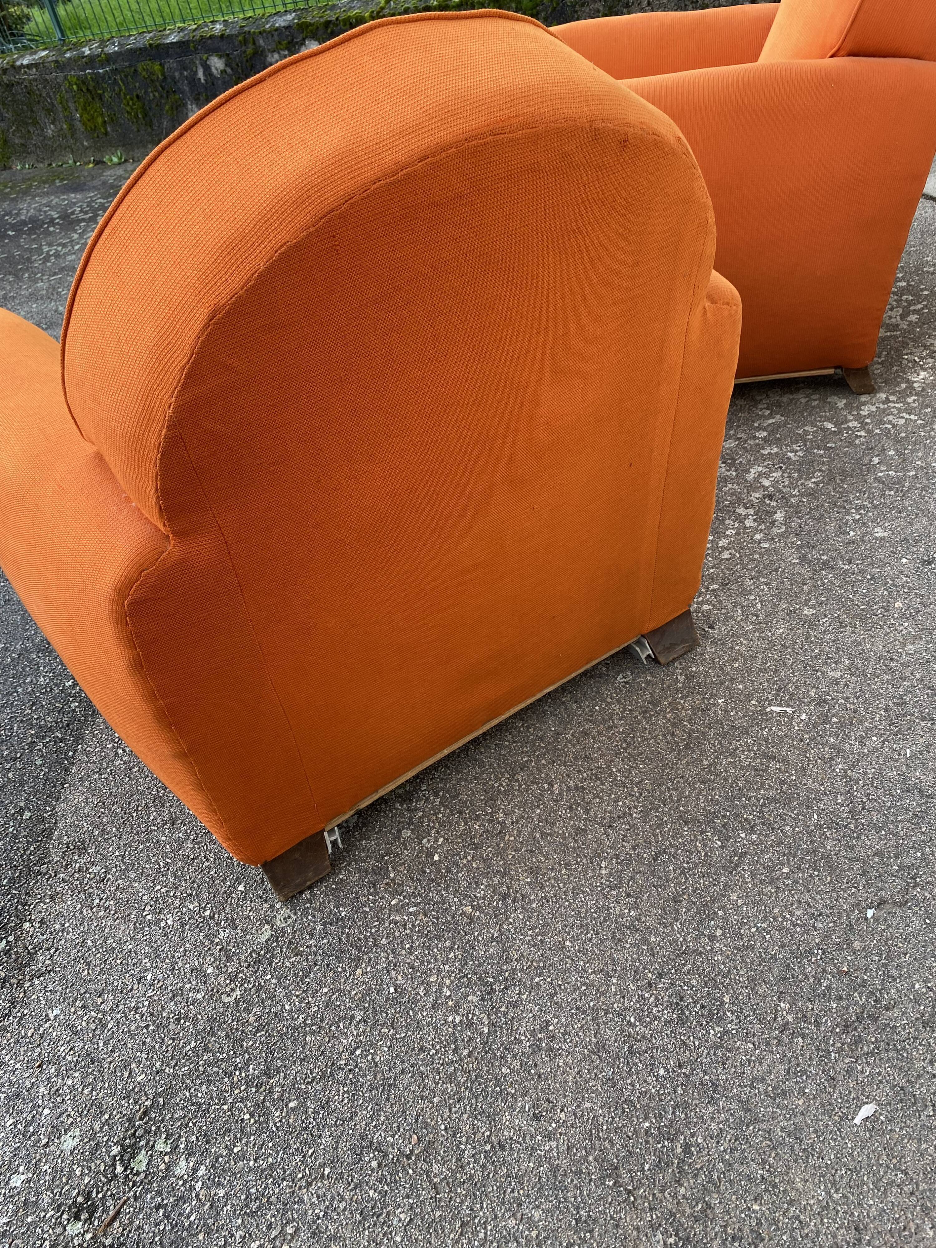 Pair of vintage orange club chairs