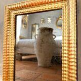 Antique gilded mirror from the Directoire period, 19th century.