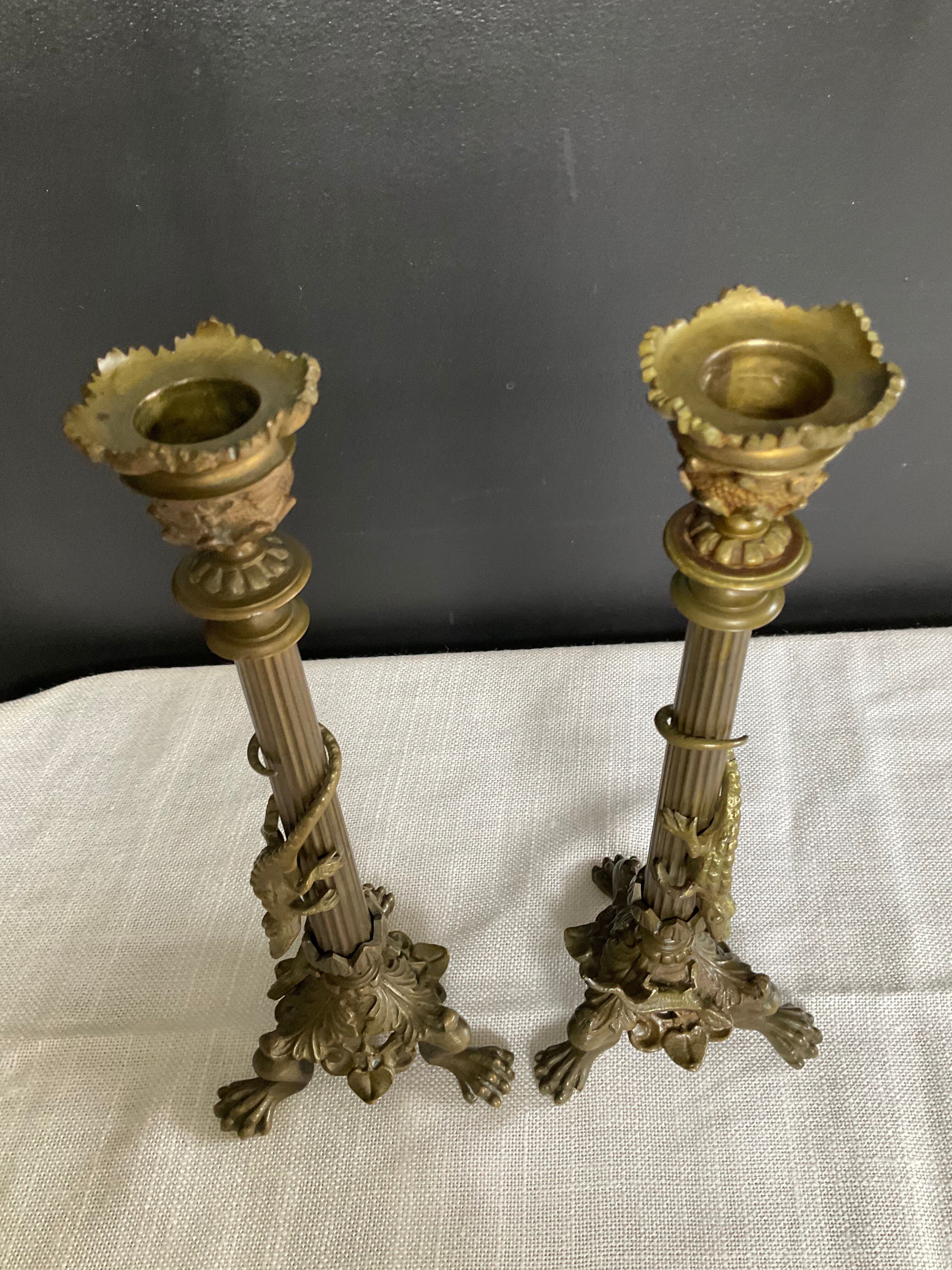 Pair of 19th-century gilded bronze candlesticks in Empire style.