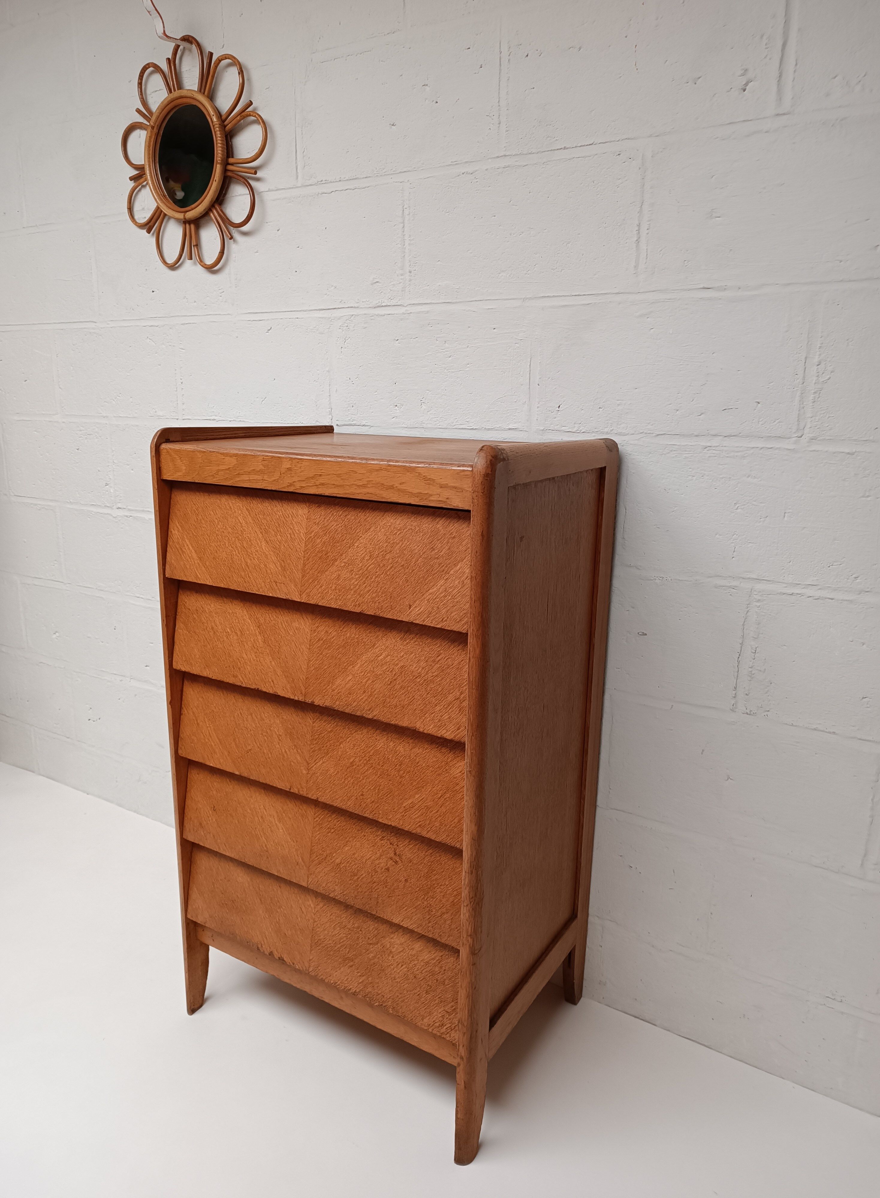 High wooden chest of drawers in the 50s