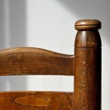 Low fireplace chair attributed to Charles Dudouyt.