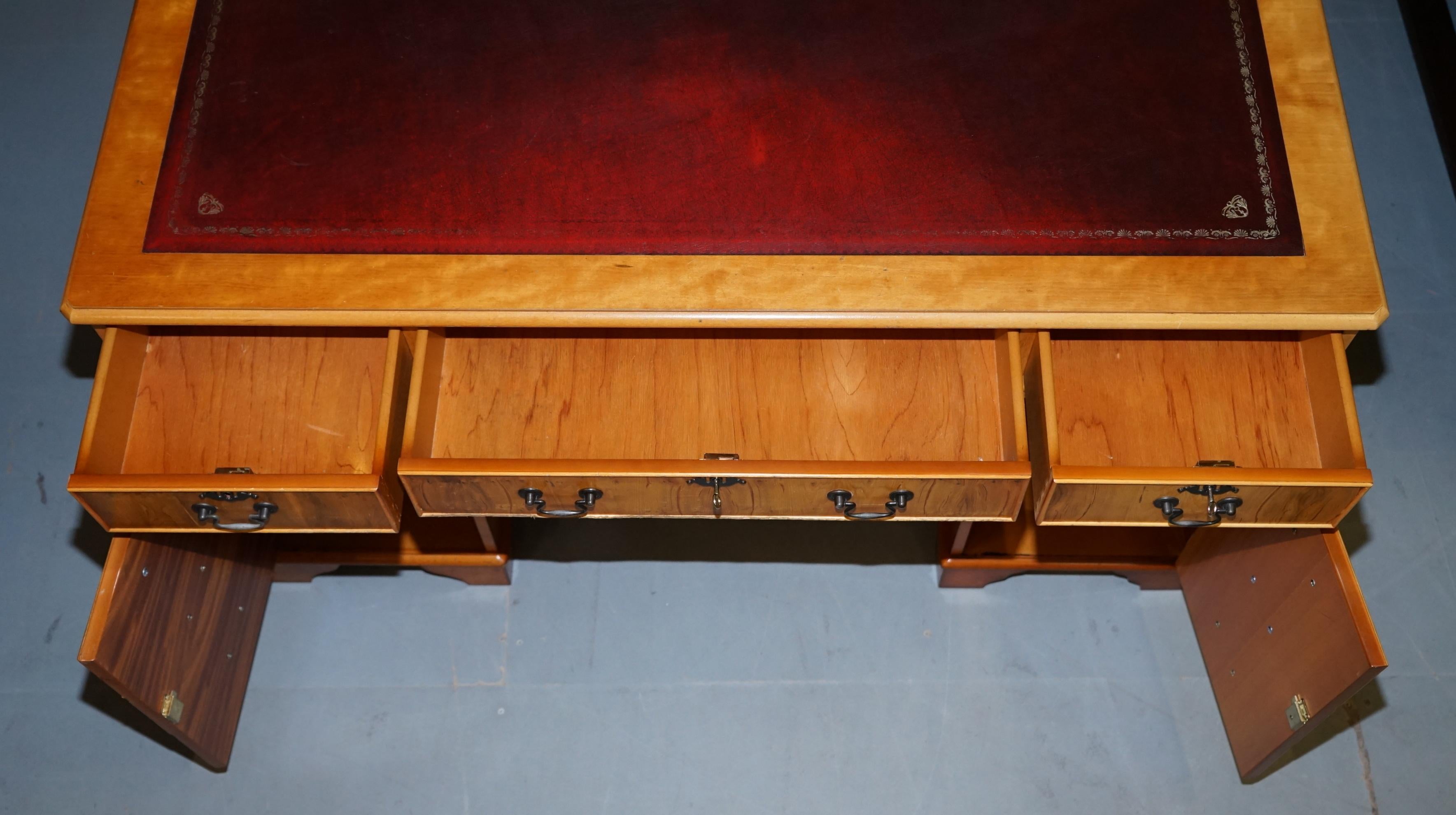 Vintage satin wood partner desk with leather top.