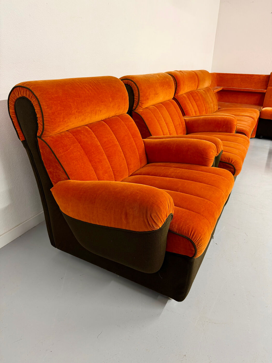 Modular vintage orange corner sofa, 1970s pop design.