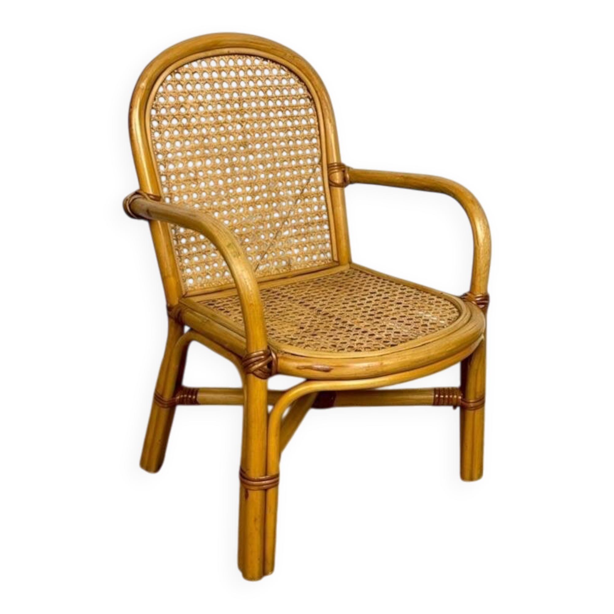 Child's armchair in rattan and caning from the 1960s.