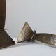 Pair of hand-hammered brass candlesticks in Memphis style.