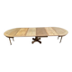 Round dining table with a central pedestal, stripped raw oak, 4 extensions, 19th century.