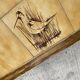 Vintage 70s coffee table with wood and ceramic tiles featuring bird and nature patterns.