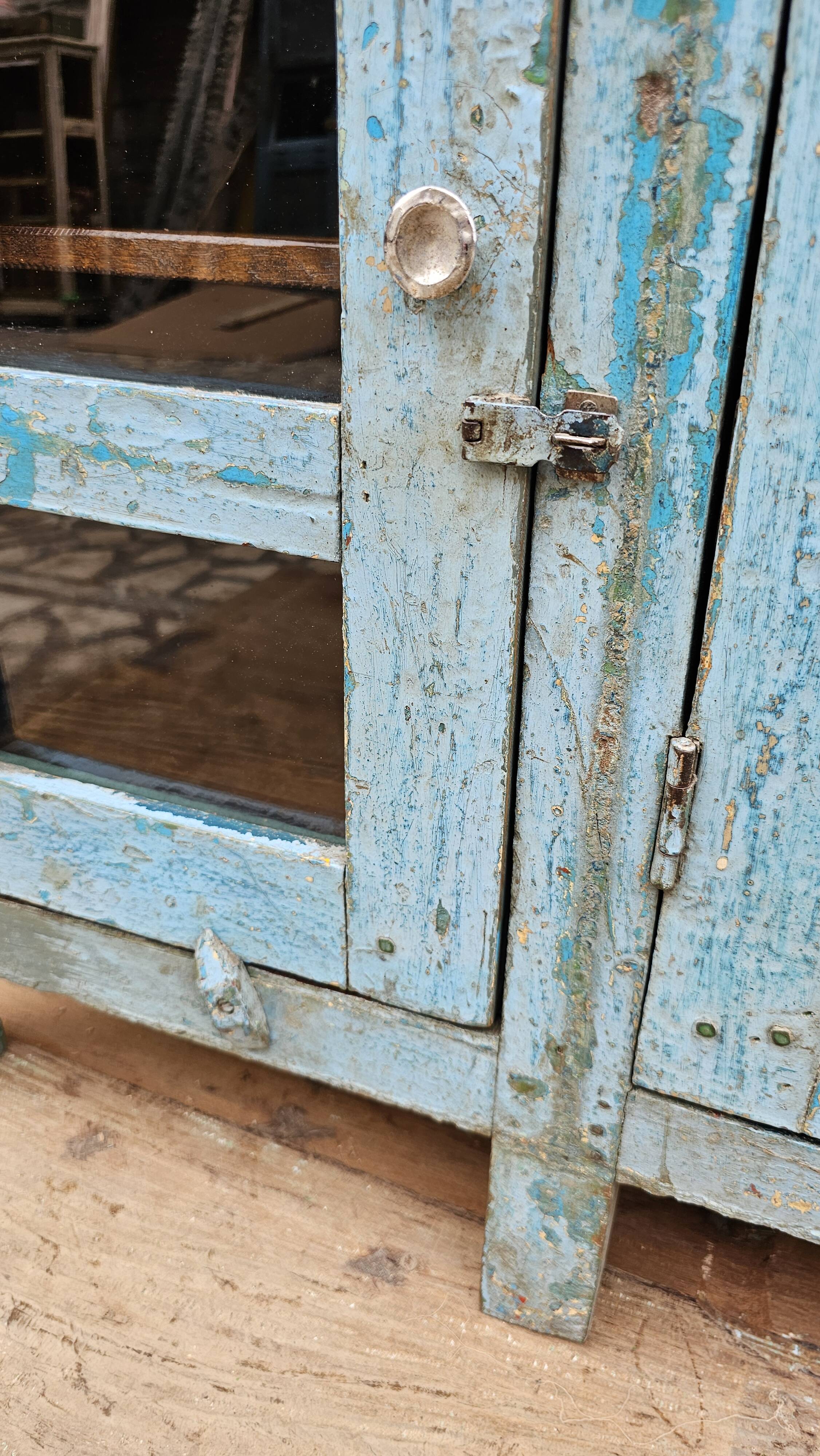 Antique glass-fronted buffet in Burmese teak