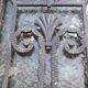 Oak entrance door and its frame and transom, wrought iron gates