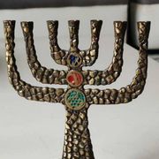 Menorah/Candlestick with 7 light arms. In old gold patinated brass/Decor 12 astrological signs. Engraved Jerusalem. Height 14 cm
