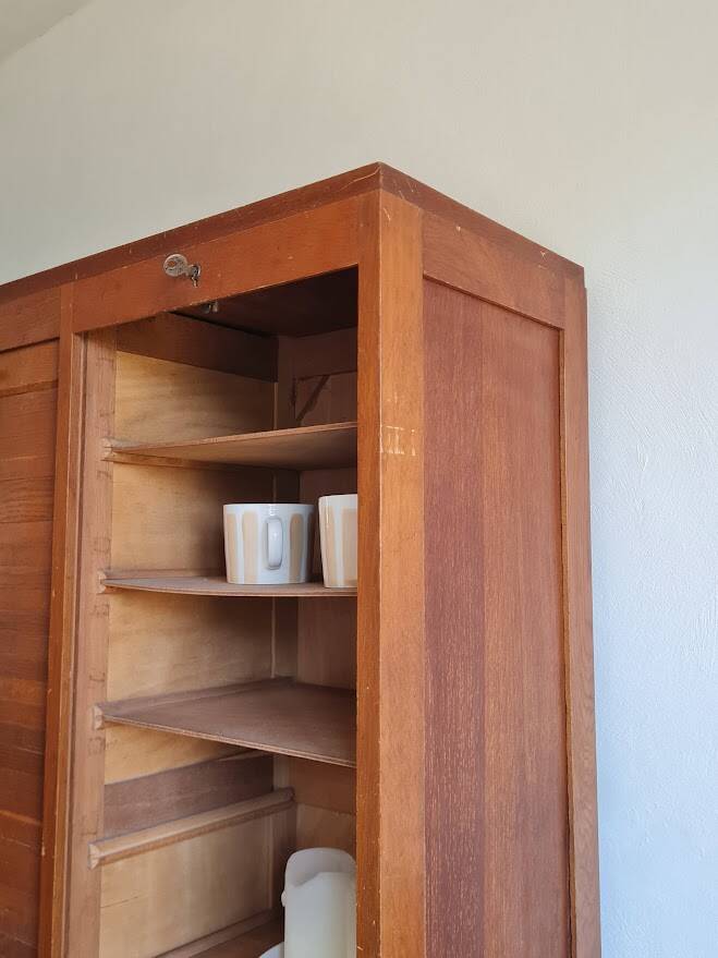 Vintage double curtain filing cabinet.