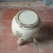 Solid wood plant stand with Louis XV style palm leaf motifs.