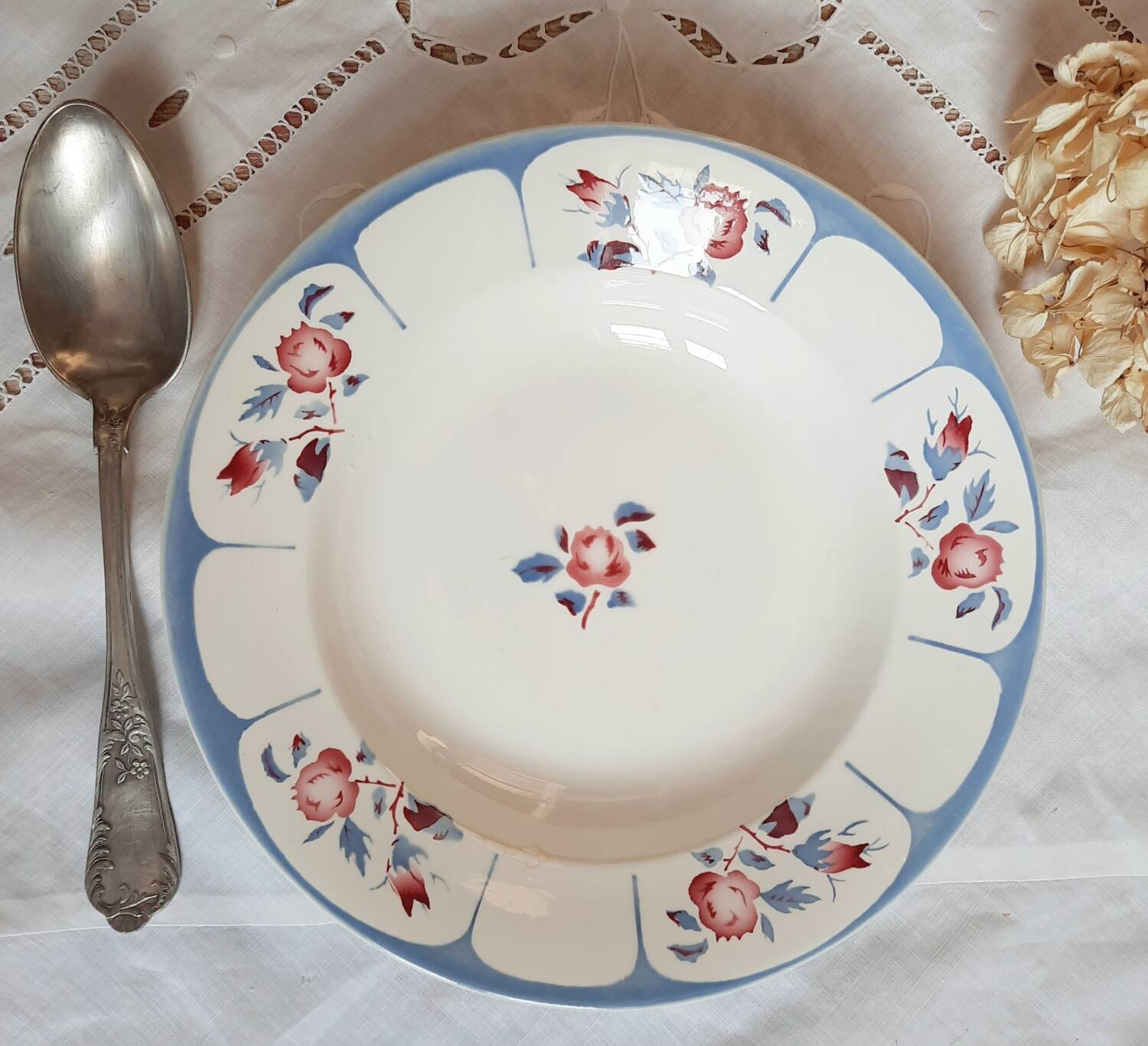 Mismatched old soup plates accompanied by a soup tureen