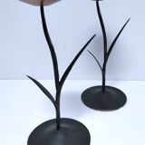 Pair of flower-shaped candlesticks in black metal and copper