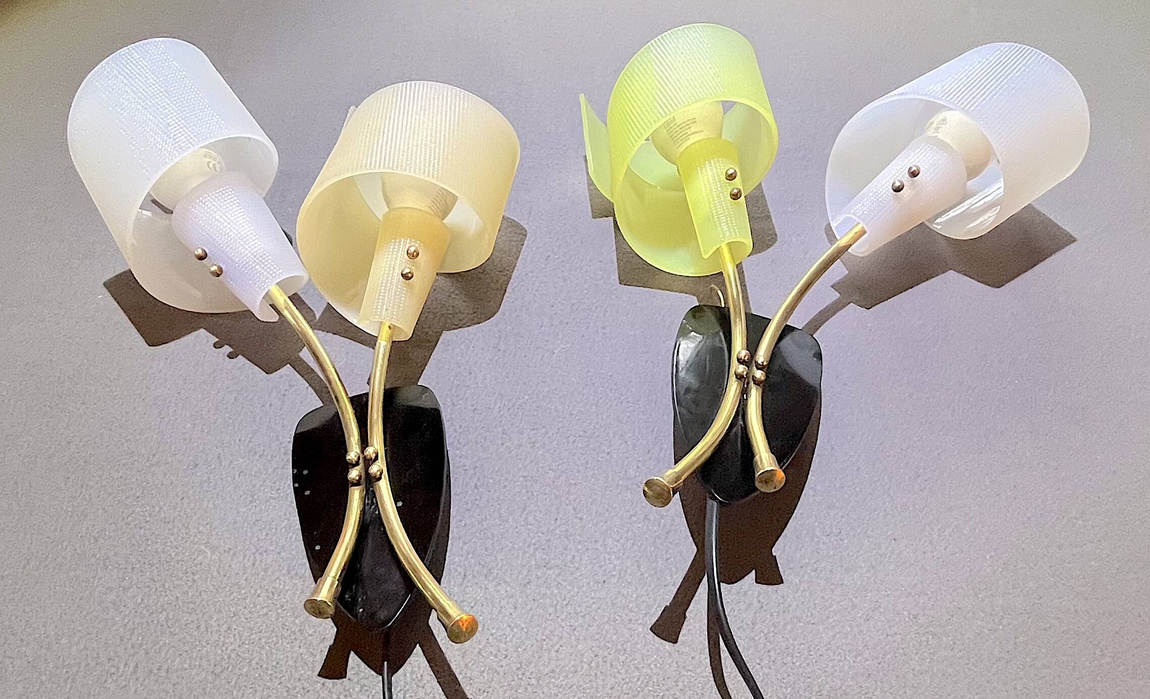 Pair of "vintage" wall lights in brass, perspex, and black bakelite, France Mid-Century