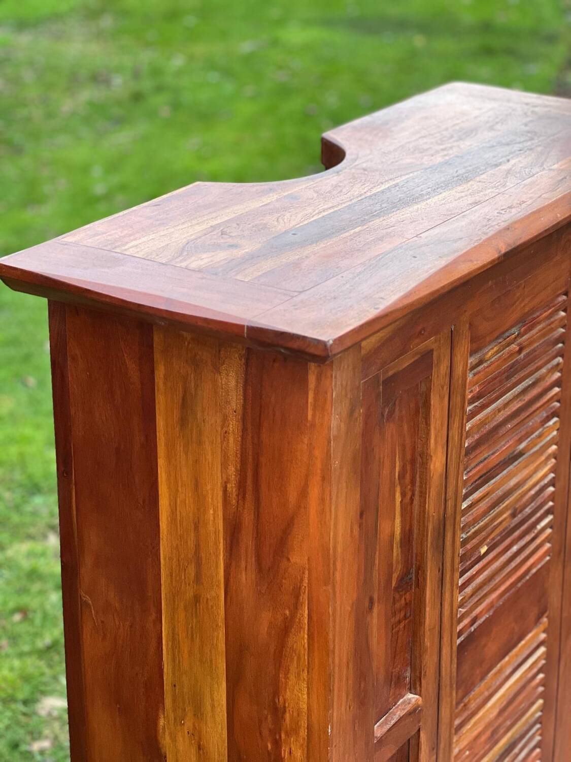 Exotic wood bar with 2 high stools.