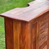 Exotic wood bar with 2 high stools.