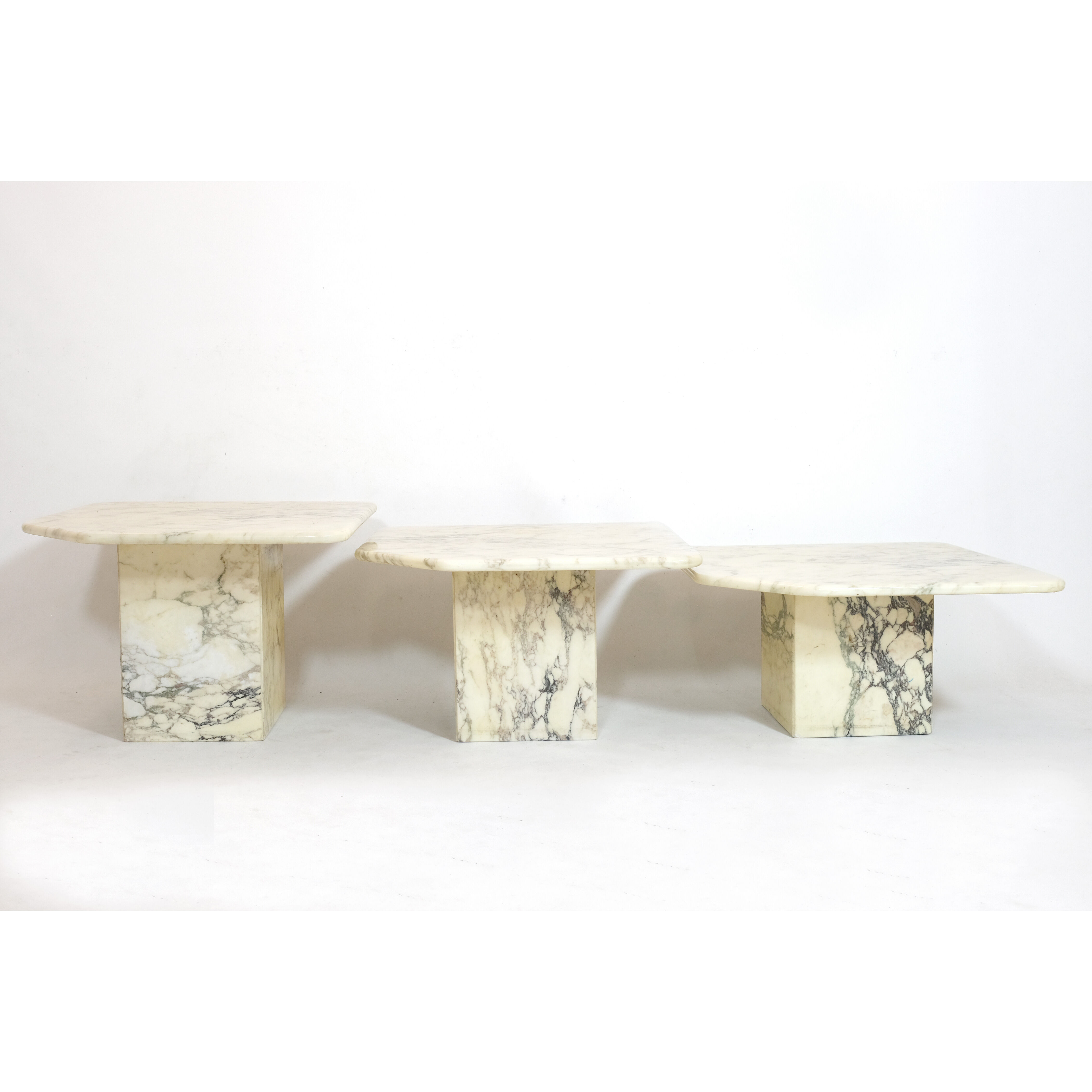 Suite of three marble trundle tables, 1970s