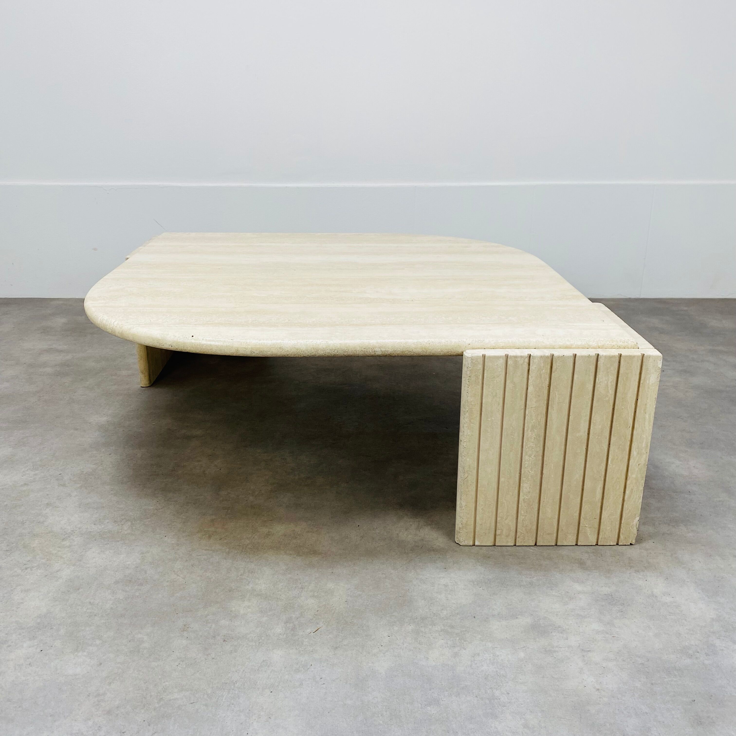 Travertine eye coffee table Roche Bobois