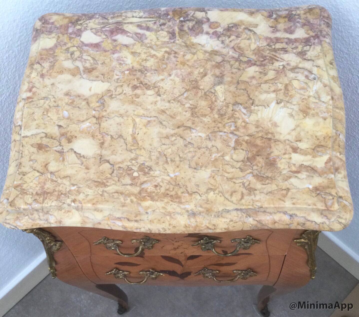 Pair of curved bedside tables in the Louis XV style with noble wood marquetry from the period.
