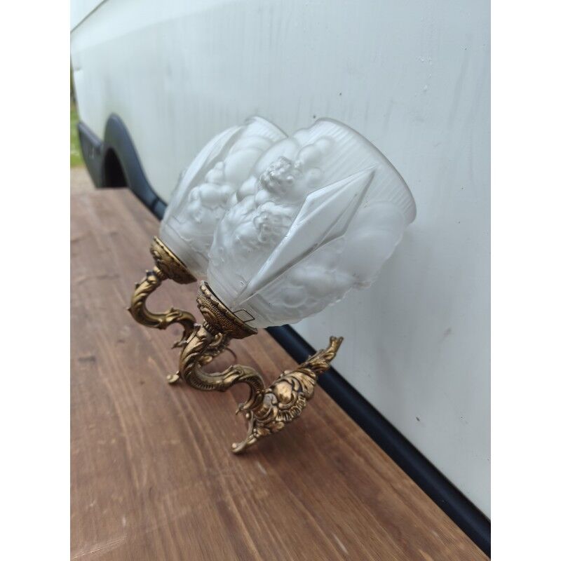 Pair of brass wall lights and glass paste.